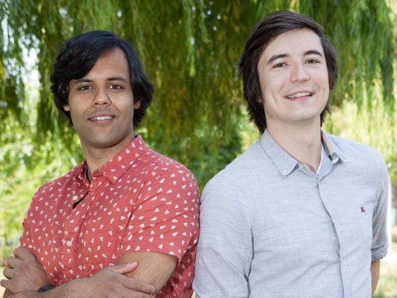 Robinhood co-founders Baiju Bhatt and Vladimir Tenev in front of a willow tree.